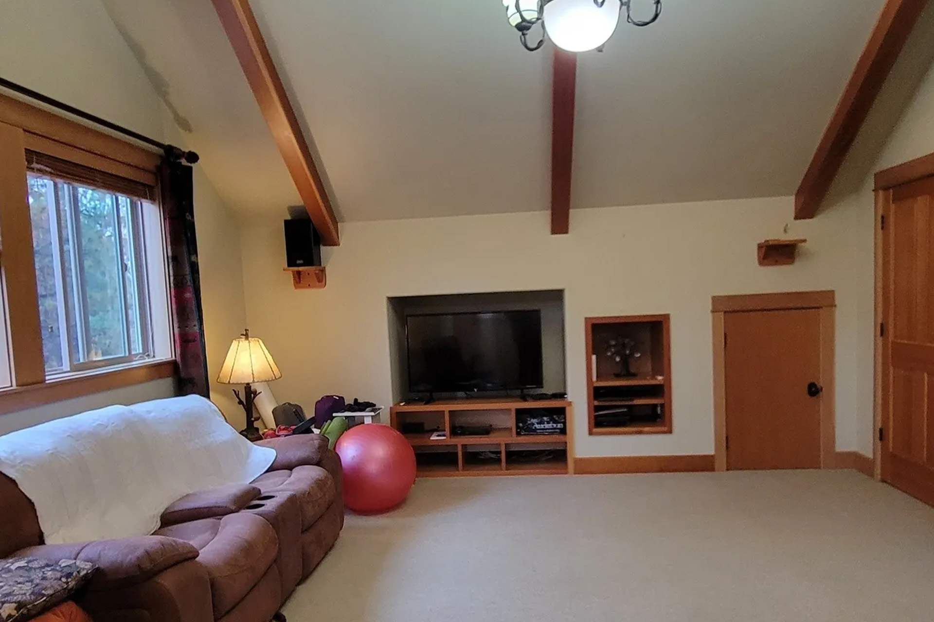 sitting room space with white interior painted walls