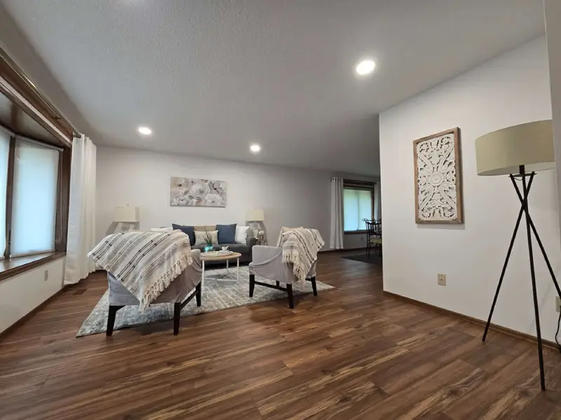 A modern living room with fresh white paint and stylish decor.