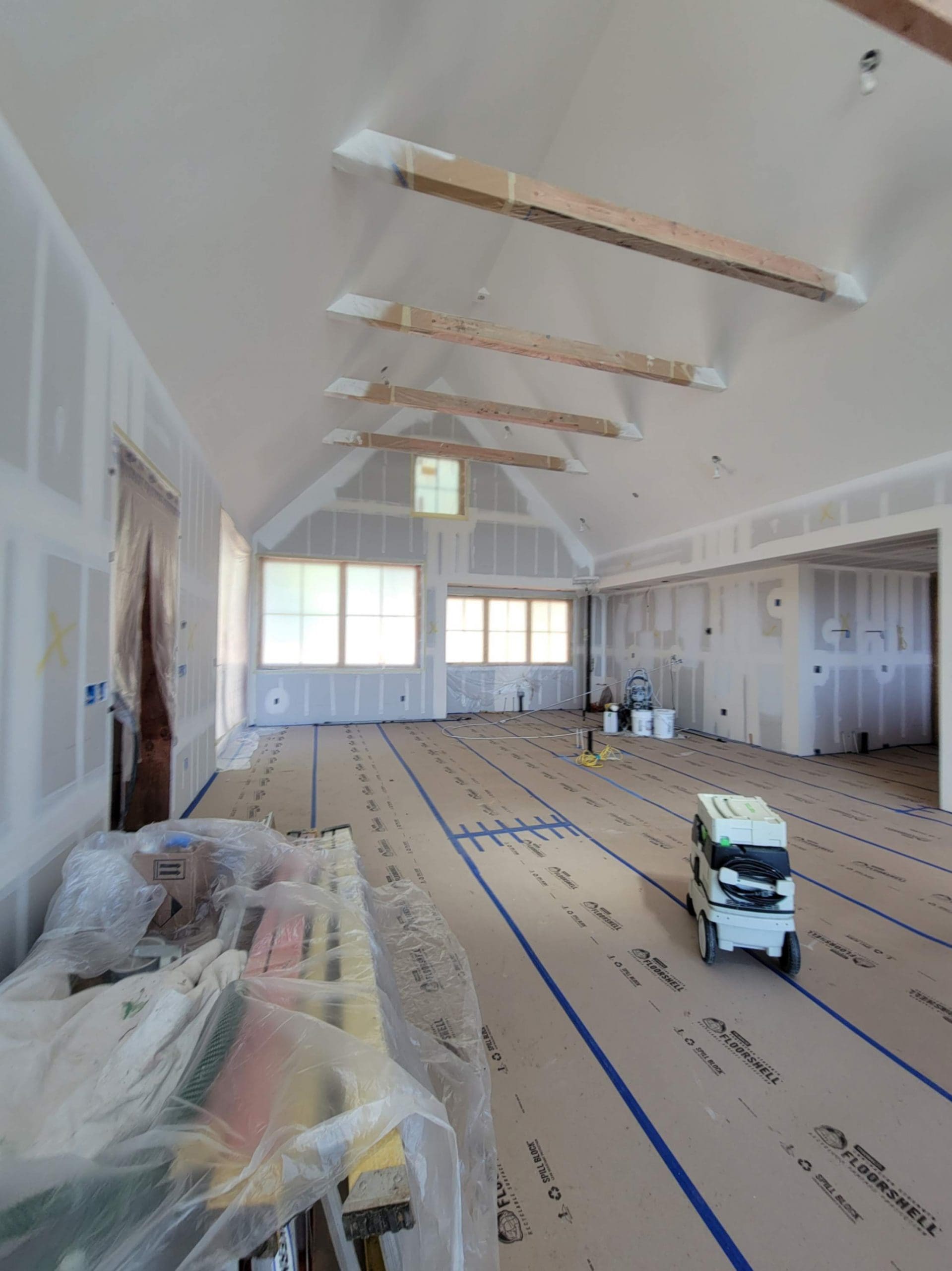 Interior painting in progress on a vaulted-ceiling Hood River home