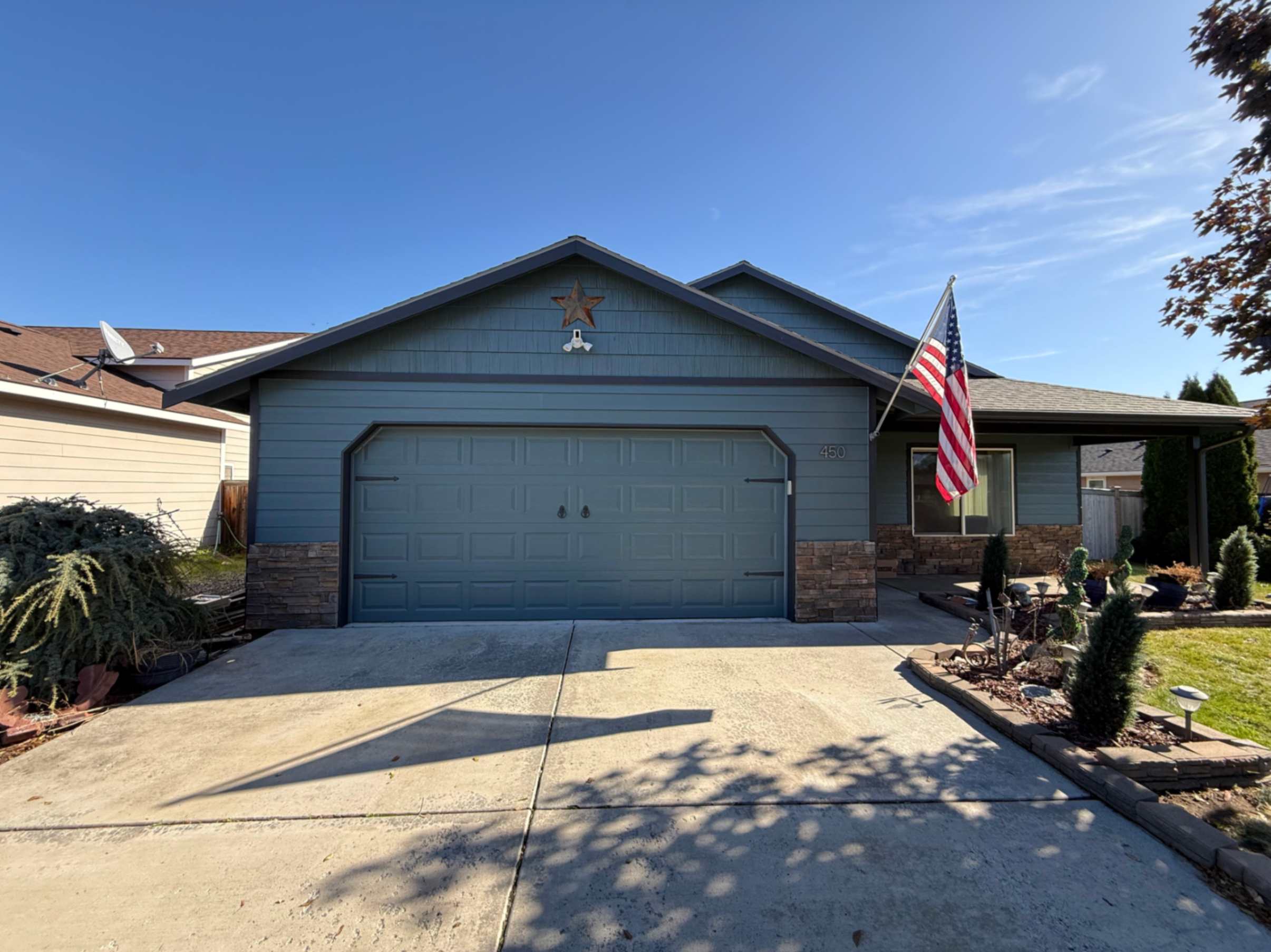 Freshly painted gray exterior on a single-story Hood River home