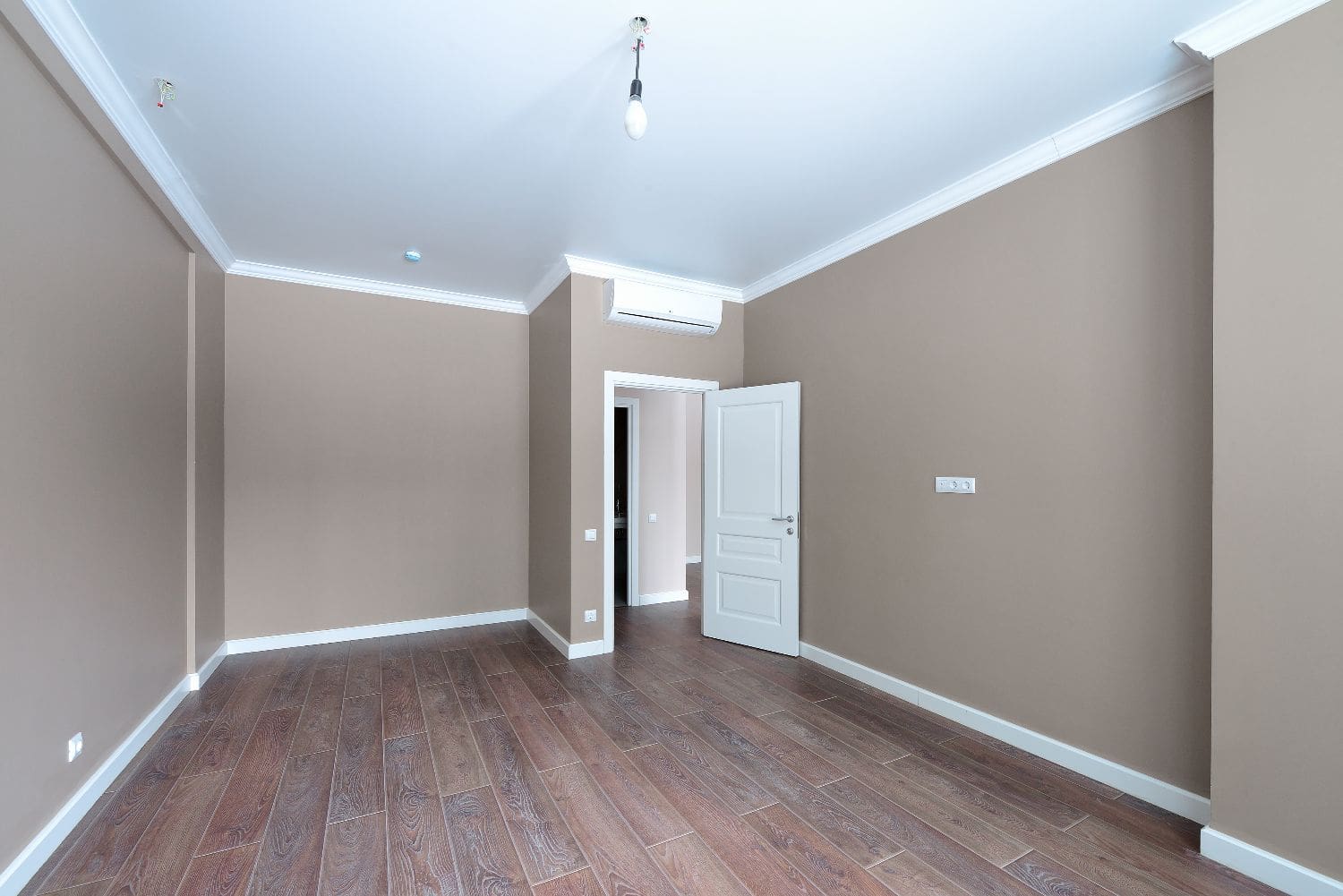 Freshly painted taupe interior with crown molding in a Hood River home