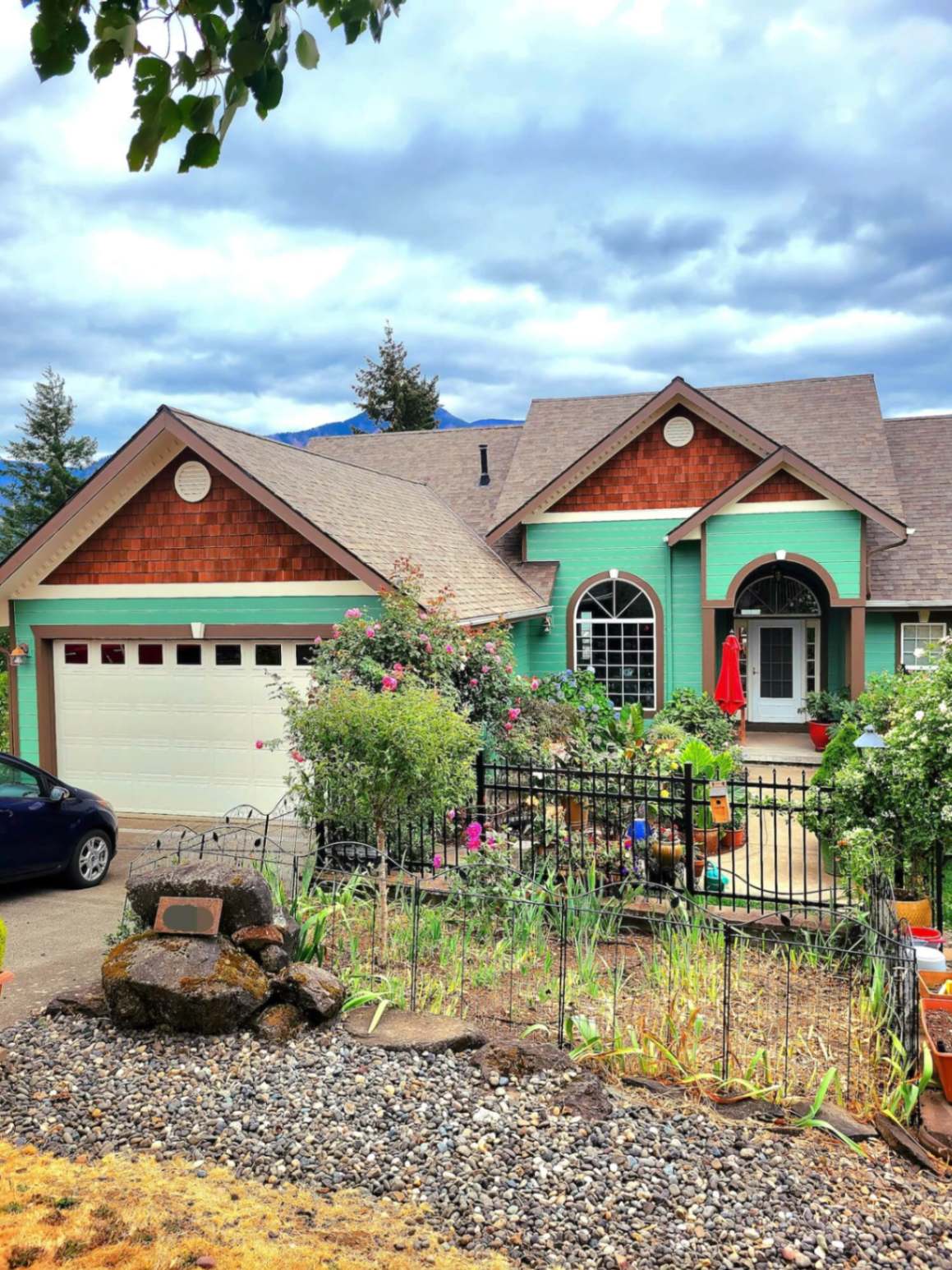 Full Bloom painters finishing a Hood River home exterior