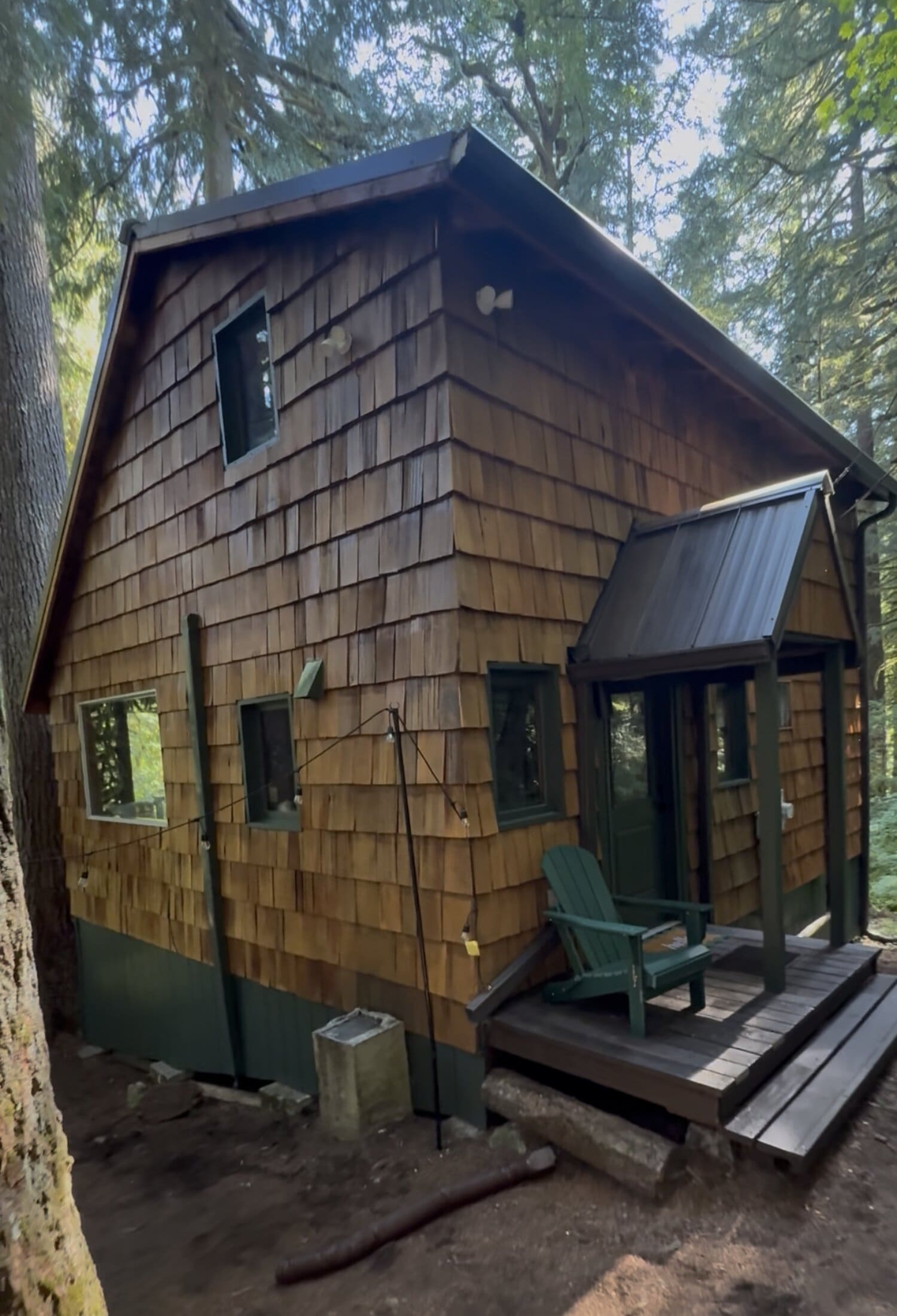 painter back-brushing exterior siding for lasting adhesion