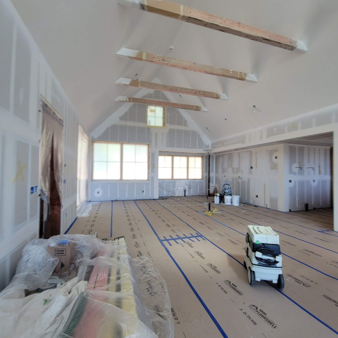 Interior painting in progress on a vaulted-ceiling Hood River home