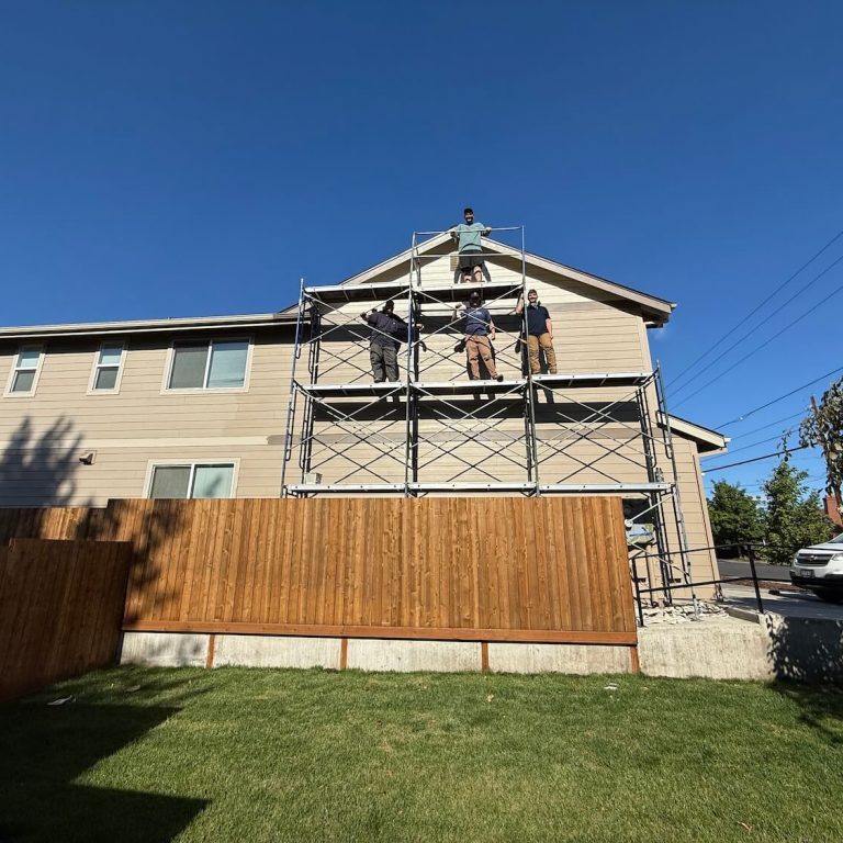 Full Bloom painting crew preparing an exterior for coating