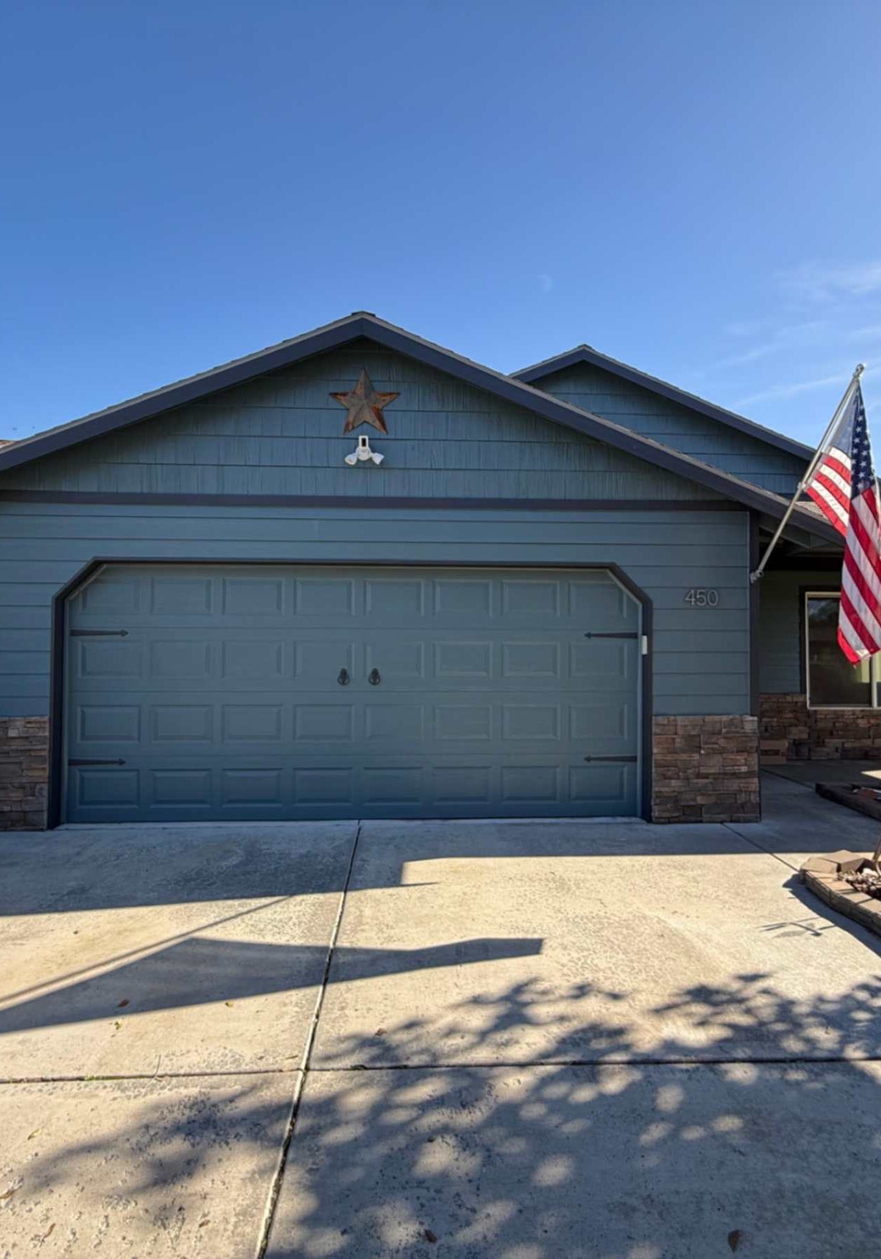 Freshly painted gray exterior on a single-story Hood River home