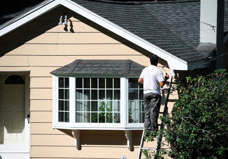 Painter working on the exterior trim of a Hood River home