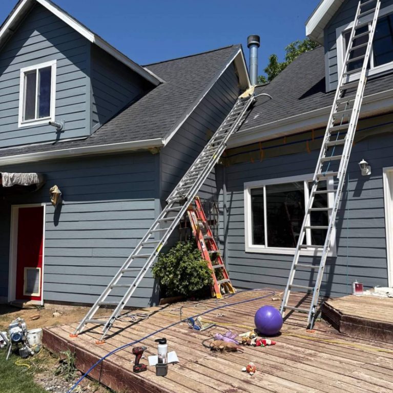 painters working on a White Salmon, WA home above the river
