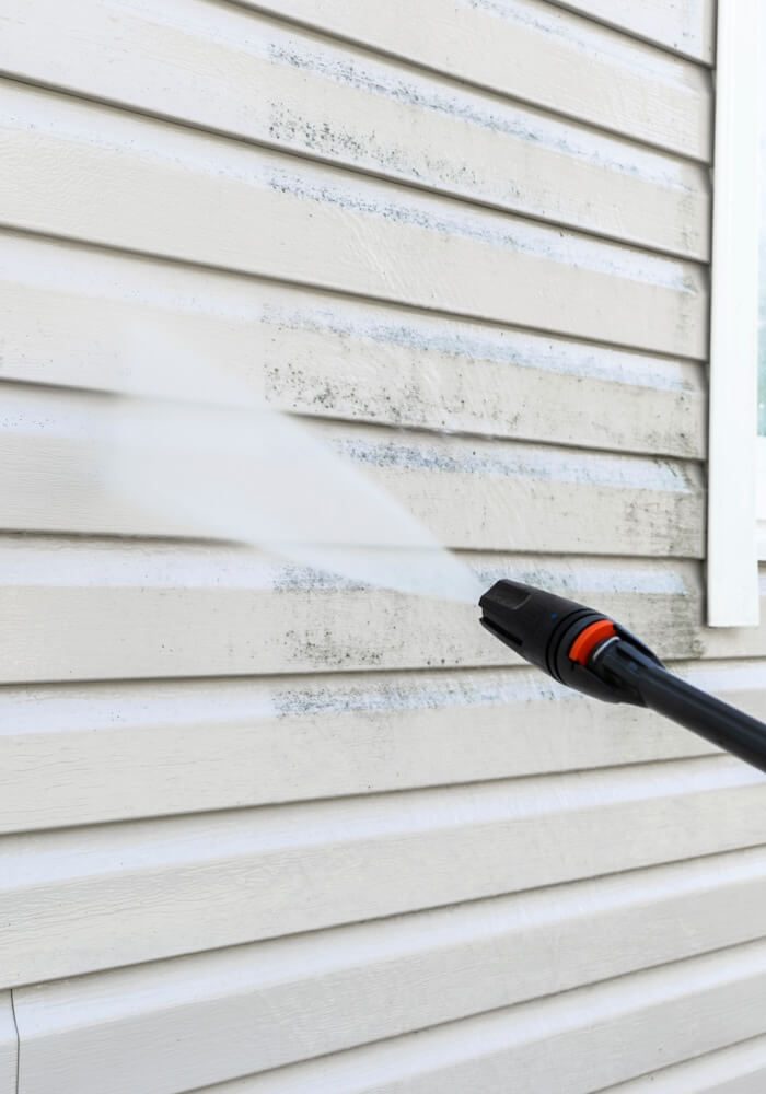 Pressure washing house siding at a White Salmon, WA home